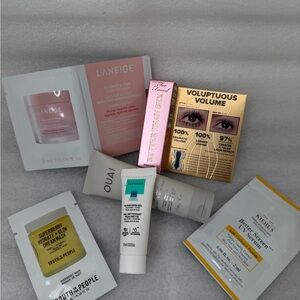 Travel size Ouai, Too Faced mascara, and skin samples